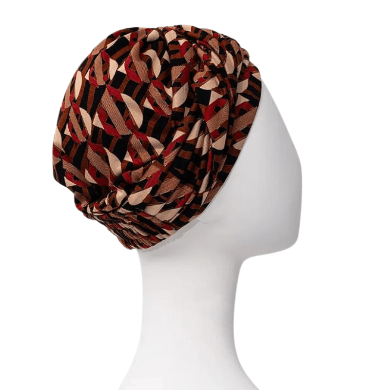 Sapphire Boho turban i Tribal Art mønster set fra højre side på en hvid mannequin