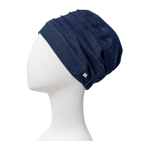 Mørkeblå Christine Headwear Yoga turban i denimstof på mannequin, set fra siden med mærke