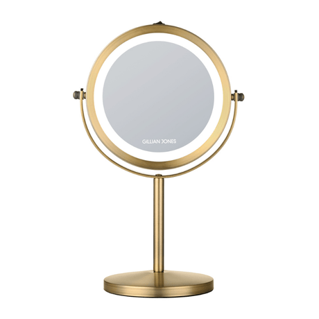 Rundt makeup-spejl med LED-lys i gylden finish, set forfra med Gillian Jones logo