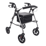 Grå Ibis rollator set skråt forfra med polstret sæde, rygbøjle og sort tekstilkurv